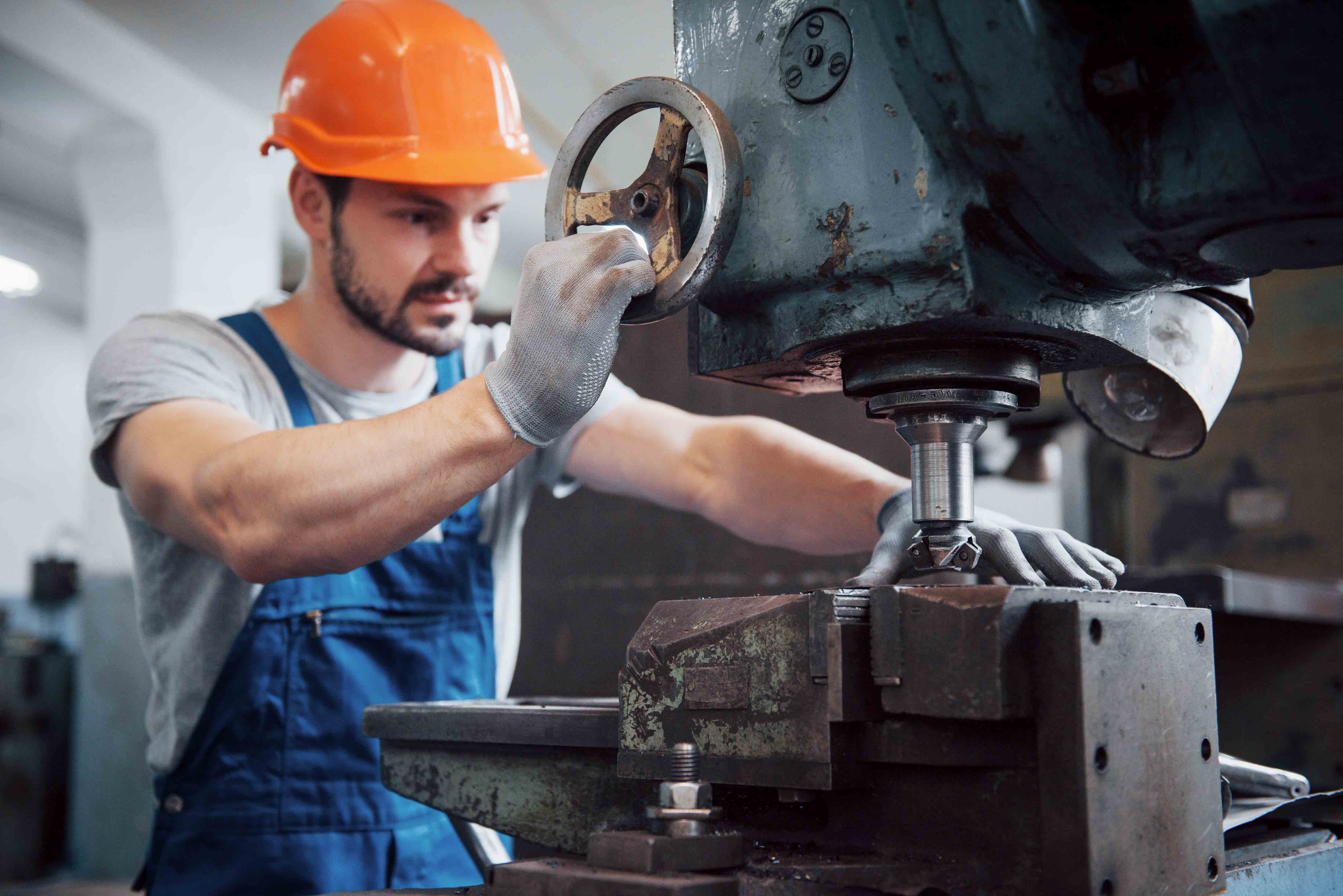 2022-04-07_847478573_portrait-young-worker-hard-hat-large-metalworking-plant.jpg